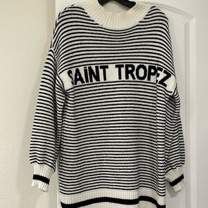 High neck, loose fitting long sleeve knotted sweater